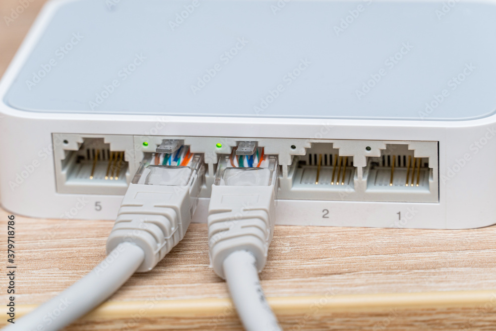 Network wires connected to the switch, router close up Network wires connected to the switch, router close up