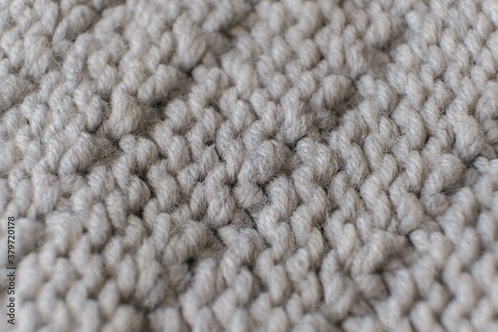 Handmade grey knitting wool texture background close up Handmade grey knitting wool texture background close up