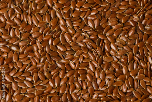 Macro photo of Raw flax seeds texture for Superfood and diet product concept. Food background of flaxseed photo