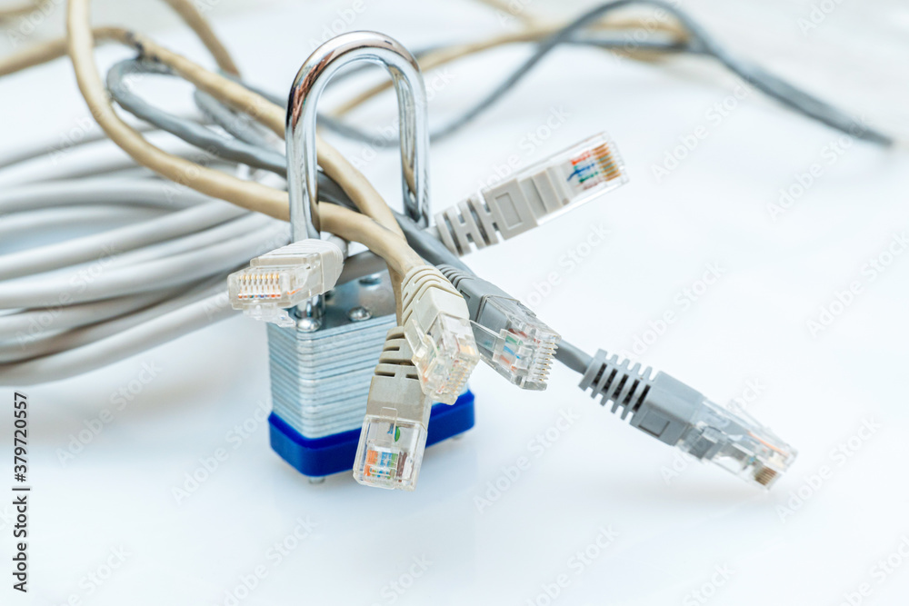 bundle of network wires blocked with metal padlock on white background bundle of network wires blocked with metal padlock on white background