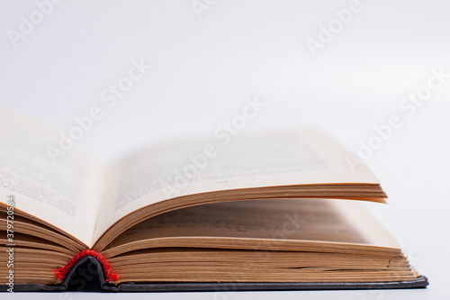Illustration of an open book on a white background.