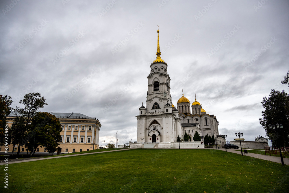 old white stone church on a hill in the old town