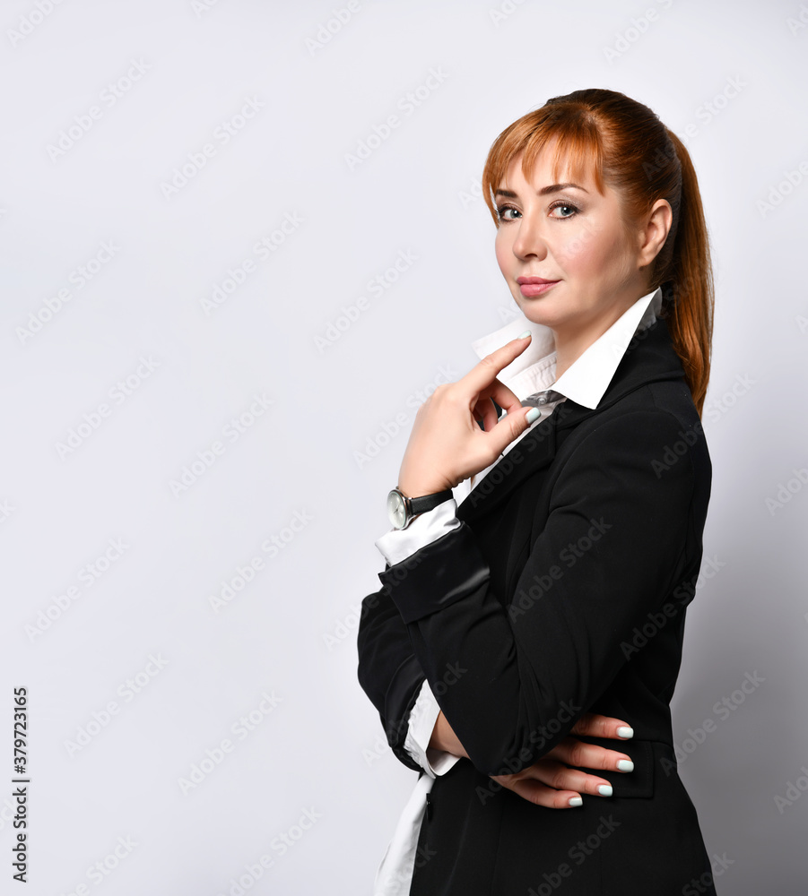 Side shot of pensive businesswoman turning head to camera and thoughtfully touching her chin. Cropped shot isolated on white, copy space Side shot of pensive businesswoman turning head to camera and thoughtfully touching her chin. Cropped shot isolated on white, copy space