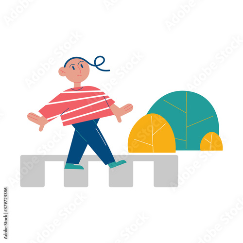 Girl crossing crosswalk in right place and memorizing traffic rules signs