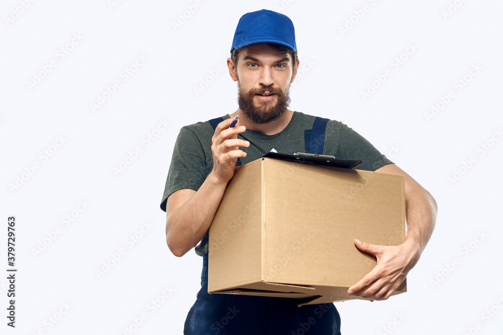 Working male courier with box in hand documents delivery service light background Working male courier with box in hand documents delivery service light background