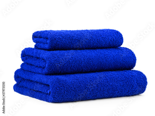 a set of plain smooth-colored cotton towels, folded in a pyramid, isolate on a white background