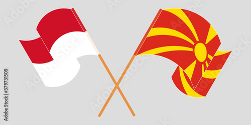 Crossed and waving flags of North Macedonia and Indonesia