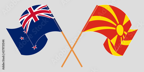 Crossed and waving flags of North Macedonia and New Zealand