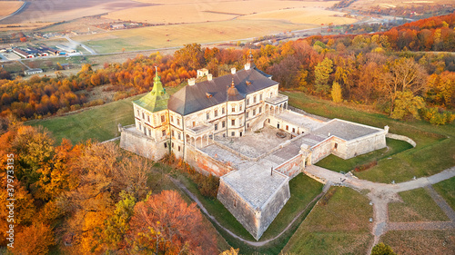 Obraz na płótnie Podgortsy Palace from the air. Sunset over autumn park on hills. w salonie