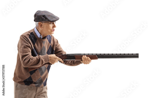 Fototapeta Angry old man aiming with a shotgun