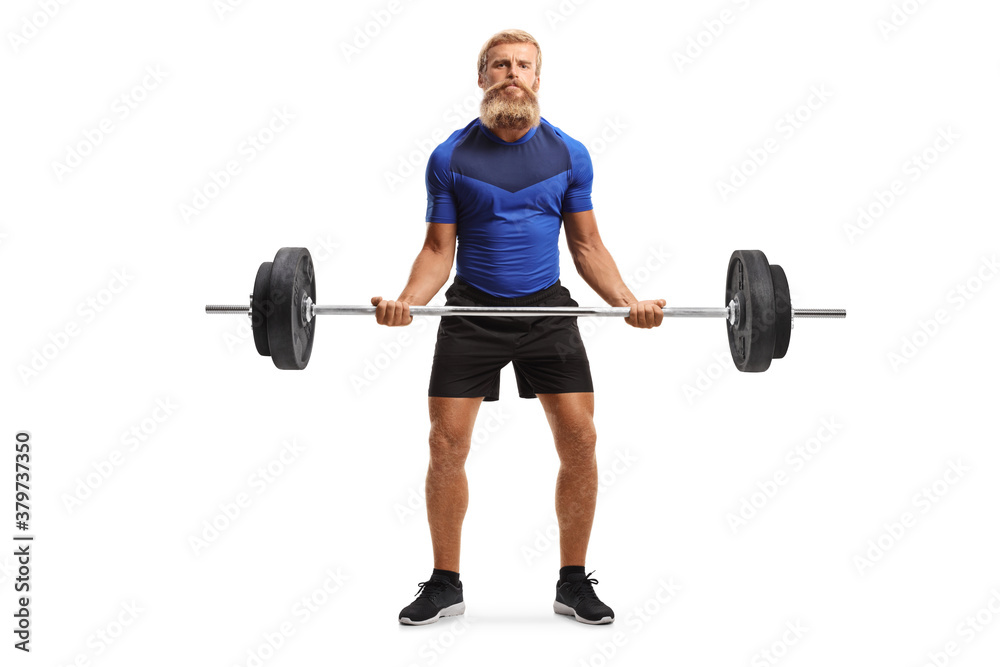 Full length portrait of a strong young man with beard and moustache lifting weights