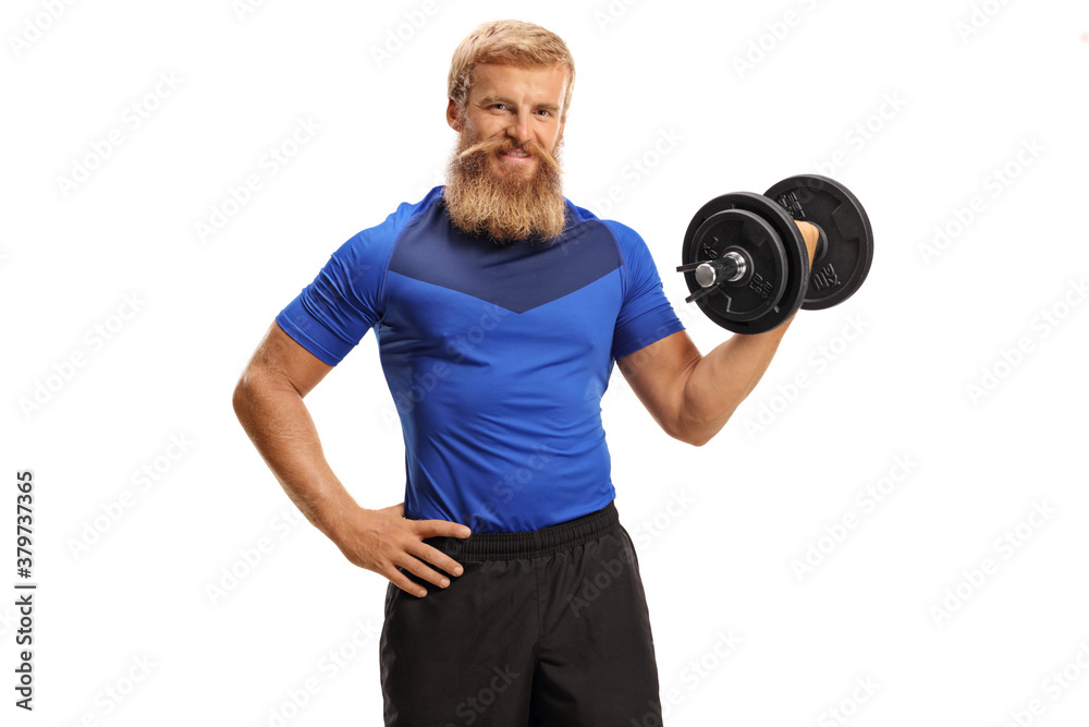 Naklejka premium Young man with beard and moustache exercising with dumbbell in one hand