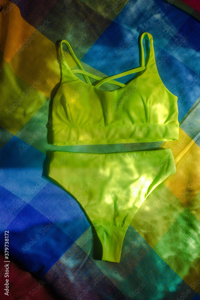 brightly
light green separate swimsuit, for recreation and sports.