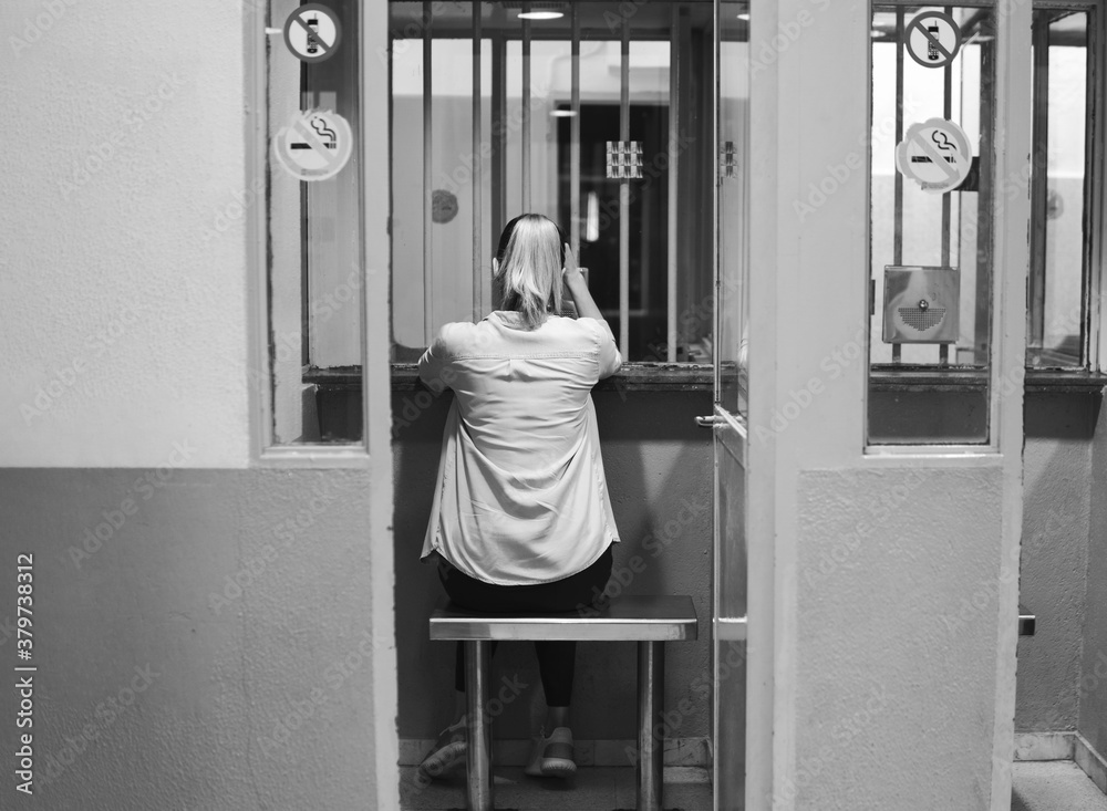 Young girl or woman looking forward to meeting a prisoner. Visiting
