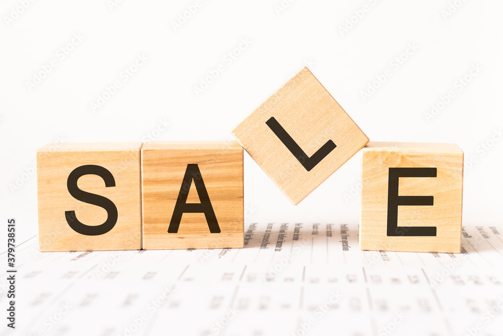 Word sale. Wooden small cubes with letters isolated on white background with copy space available.Business Concept image. Word sale. Wooden small cubes with letters isolated on white background with copy space available.Business Concept image.