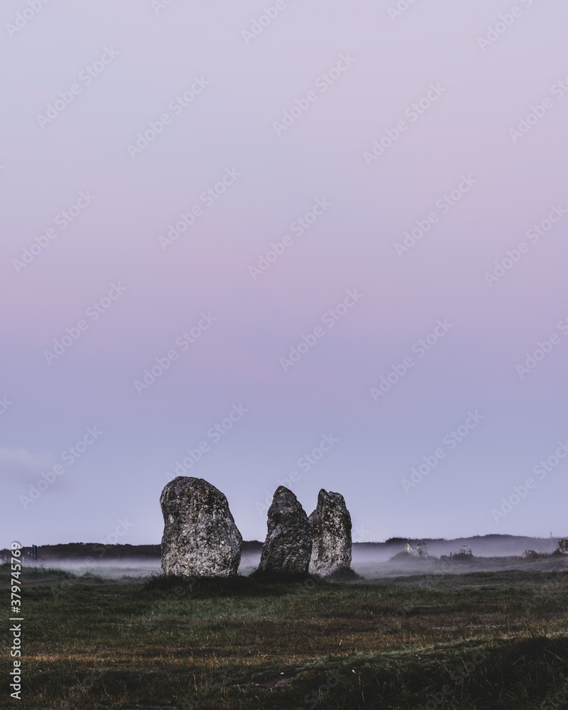 Menhir alignment view at Camaret sur mer in a mysterious morning fog at ...
