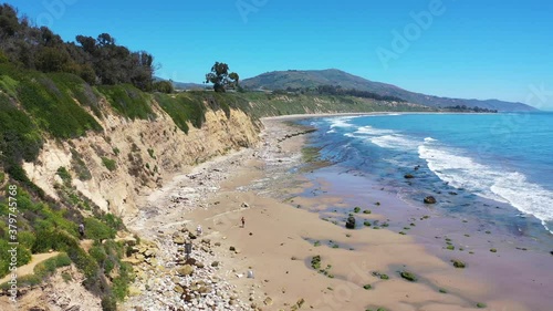 Aerial over people enjoying the beautiful coastline of Santa Barbara, California near Carpinteria bluffs.