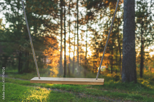 Simple swings in the contoured sunset light