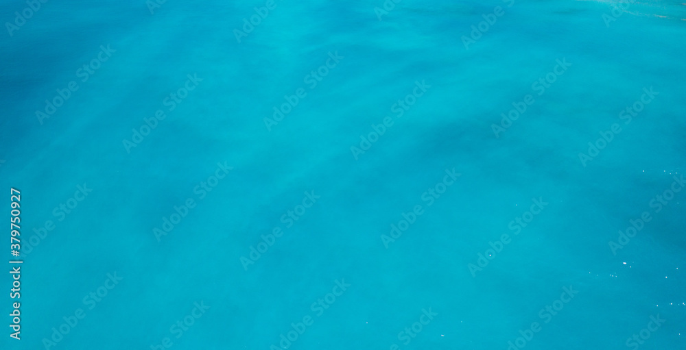 aerial shot of strange colors of water in the ocean 