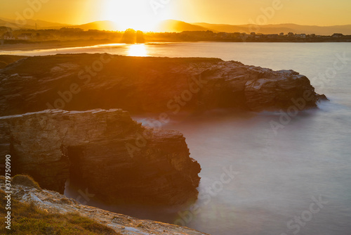 sunset at the Catedrales or Augas Santas beach, in Ribadeo. Lugo, Galicia photo