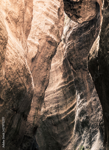 sunlight from above illuminating the white texured rocks in the Avakas gorge canyon in cyprus