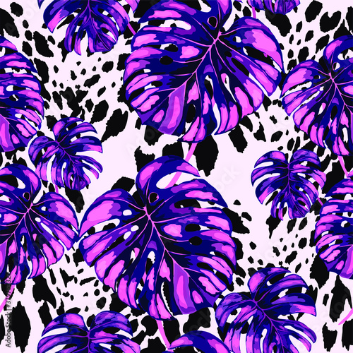 Tropical seamless pattern on animalistic texture. Jungle exotic summer print. Summer tropical leaf. Tropical flower fashion pattern. Floral tropic illustration. Vector seamless pattern.