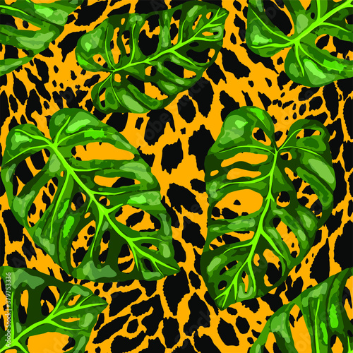 Tropical seamless pattern on animalistic texture. Jungle exotic summer print. Summer tropical leaf. Tropical flower fashion pattern. Floral tropic illustration. Vector seamless pattern.