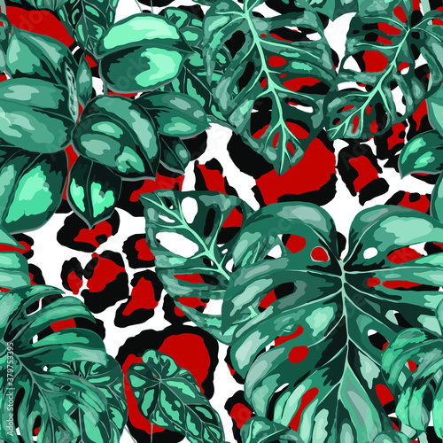Tropical seamless pattern on animalistic texture. Jungle exotic summer print. Summer tropical leaf. Tropical flower fashion pattern. Floral tropic illustration. Vector seamless pattern.