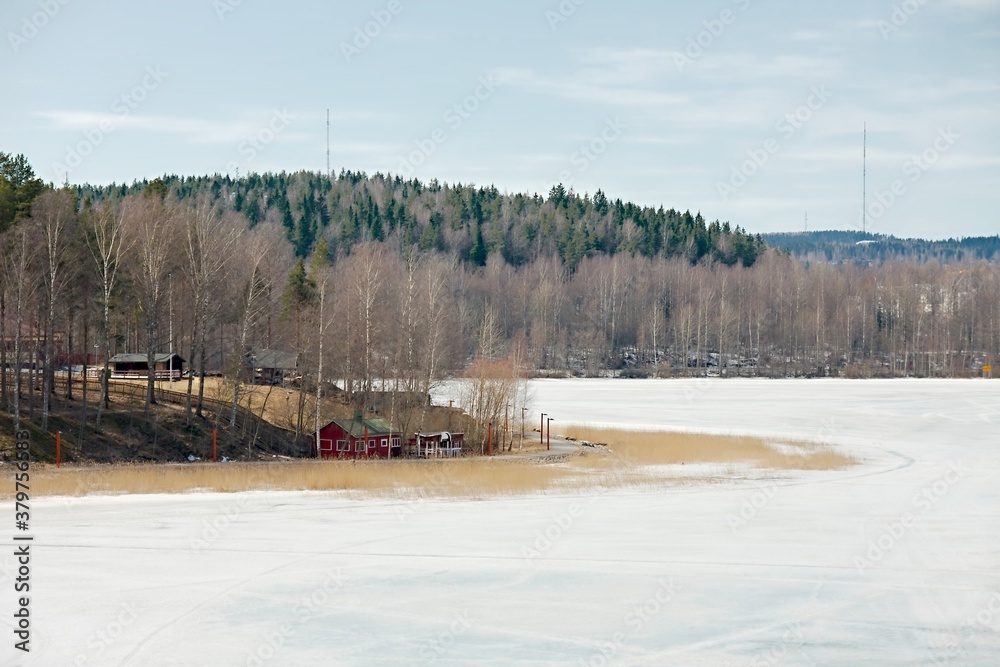 Fototapeta premium Frozen lake landscape in Finland, cold early spring