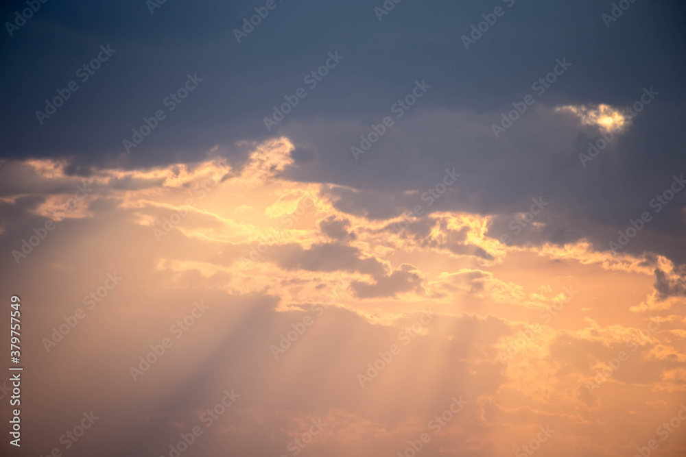 Sky at sunset late afternoon with reflections colored in orange color of the sun image conveys reflection and spirituality