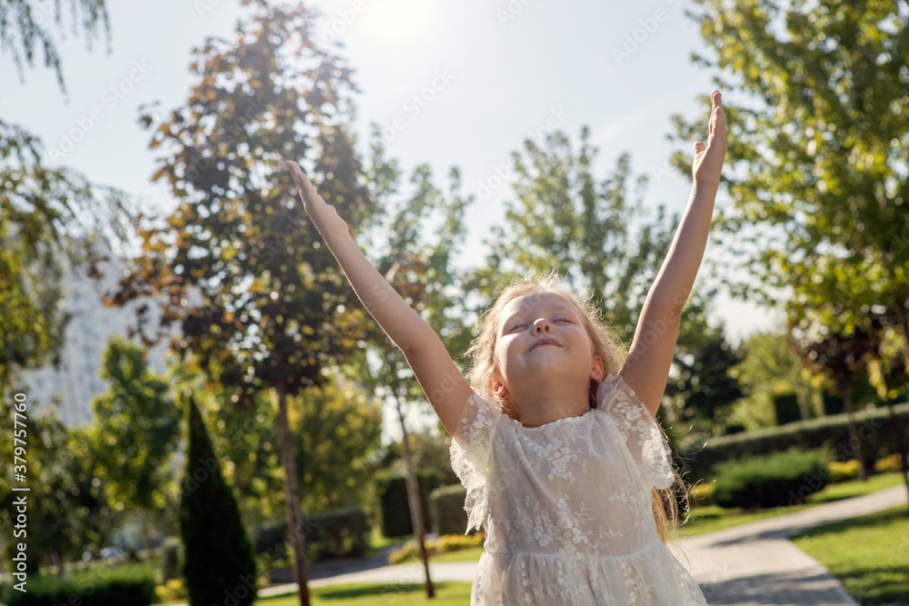little girl in a white dress on sunshine little girl in a white dress on sunshine