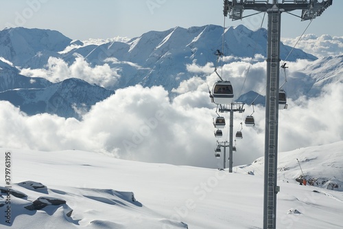 Ski lift cabins in snowy mountains in Alpe d'Huez photo