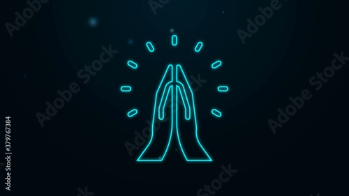 Glowing neon line Hands in praying position icon isolated on black background. Prayer to god with faith and hope. 4K Video motion graphic animation