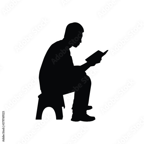 Sitting man read a book silhouette vector