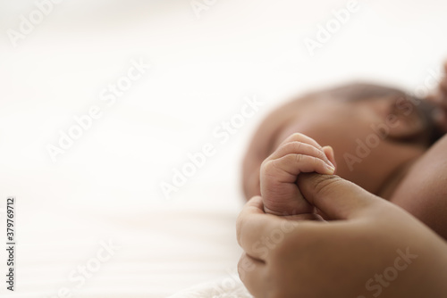 Schilderij op canvas african american infant baby lying on bed