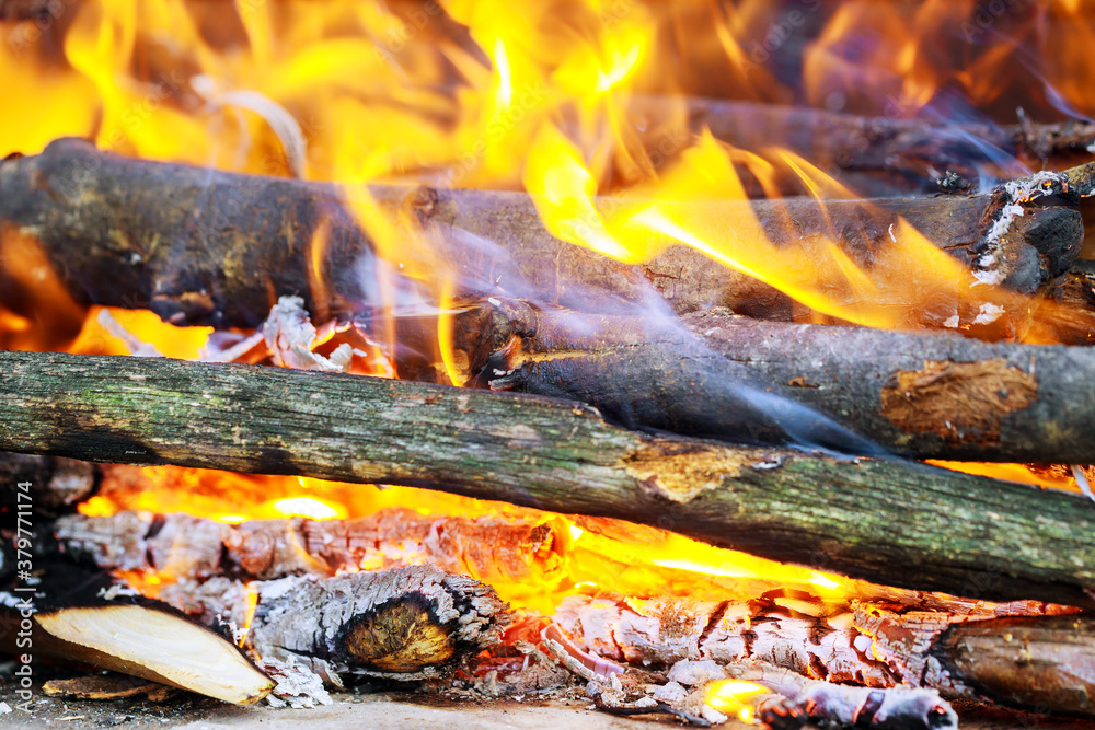 Yellow flames in the fire with wood and log. Yellow flames in the fire with wood and log.