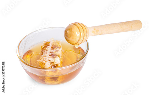 honey dipper and honey an isolated on white background