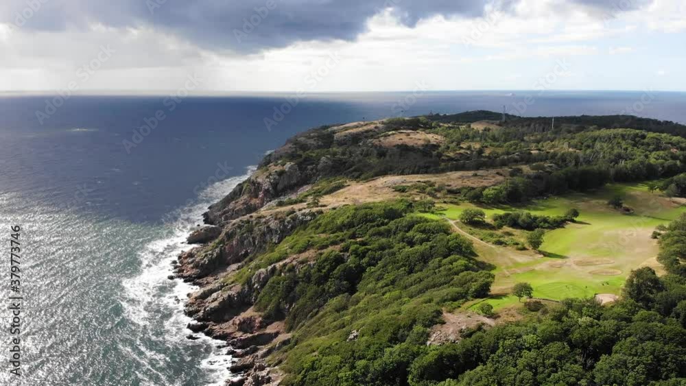 Forward going drone view of Kullaberg from high up in summer Forward going drone view of Kullaberg from high up in summer