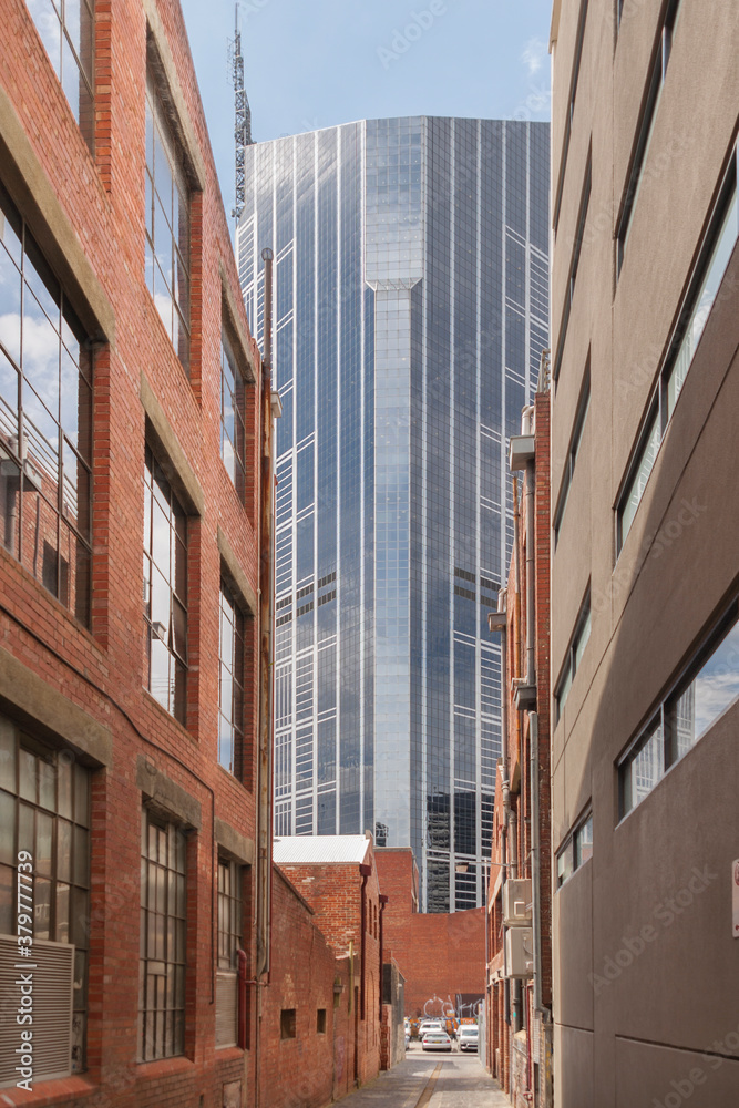 View down an historic alley to a modern skyscraper View down an historic alley to a modern skyscraper