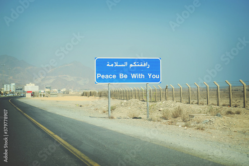 A sign on the roadside in the United Arab Emirates says 