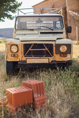 57/5000 Old and abandoned vehicle in a town of Soria, Spain. photo