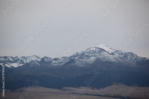 Snow Covered Mountains In The Distance photo