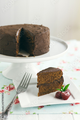 Slice of chocolate cake with copy space above