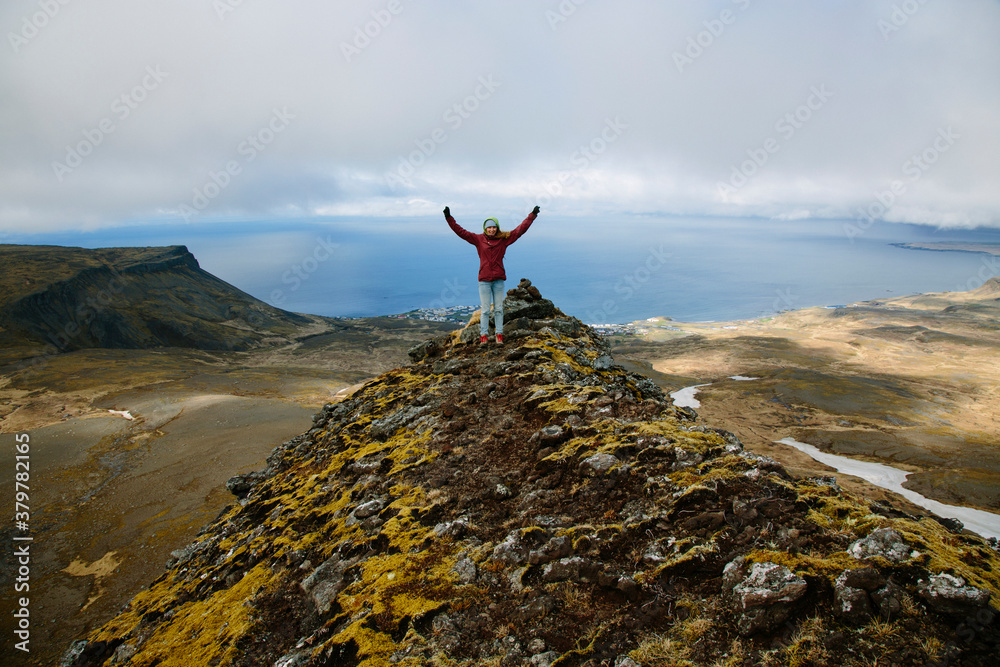 Girl Standing On Top Of A Mountain In Iceland Girl Standing On Top Of A Mountain In Iceland