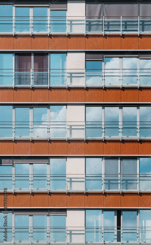 Reflection of sky in windows of building facade. Reflection of sky in windows of building facade.