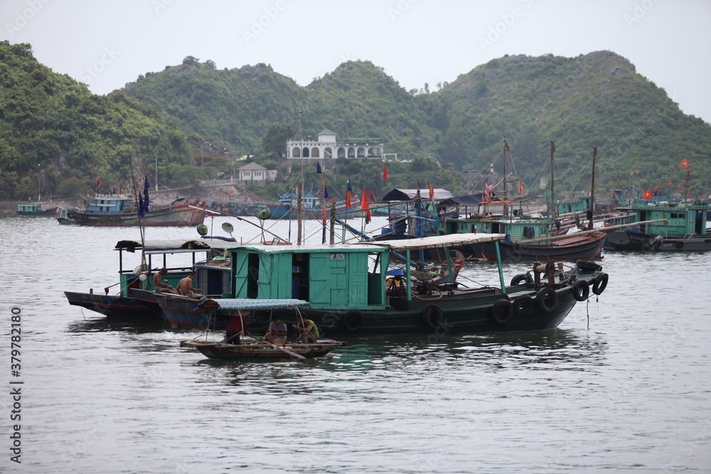 Floating Fishing Village In The Ha Long Bay. Cat Ba Island, Vietnam Asia. Cat Ba, Vietnam - March 5, 2020 Floating Fishing Village In The Ha Long Bay. Cat Ba Island, Vietnam Asia. Cat Ba, Vietnam - March 5, 2020