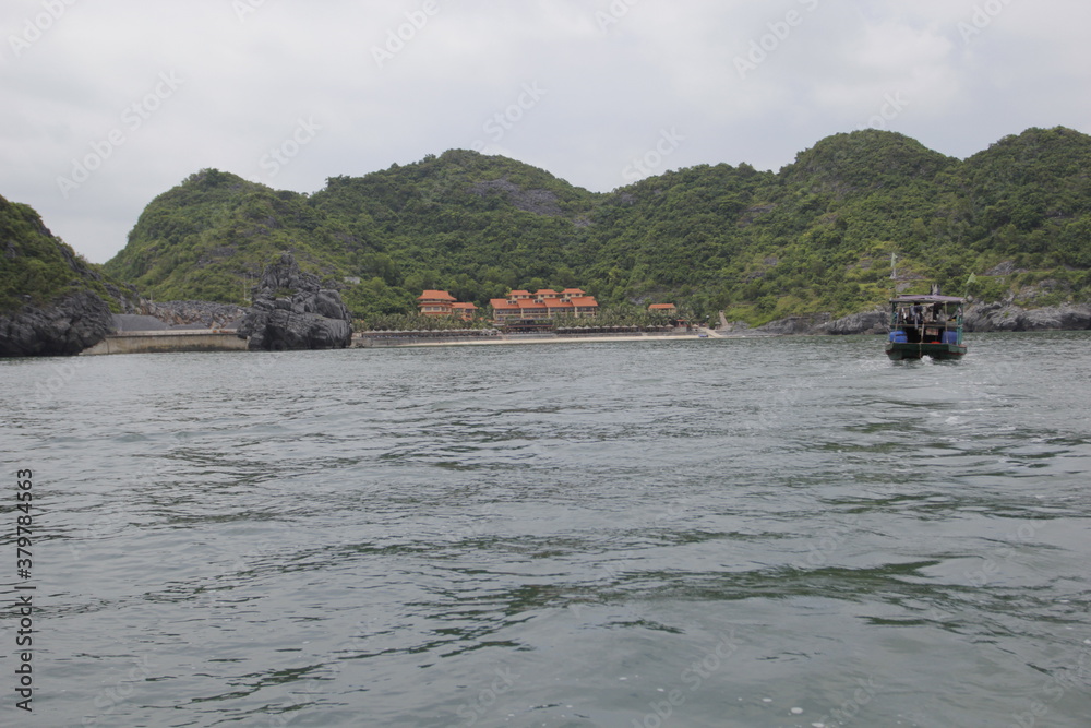 HA LONG BAY, VIETNAM - NOVEMBER 13, 2018: Halong Bay, Vietnam. Unesco World Heritage Site. Traditional tourist boats.