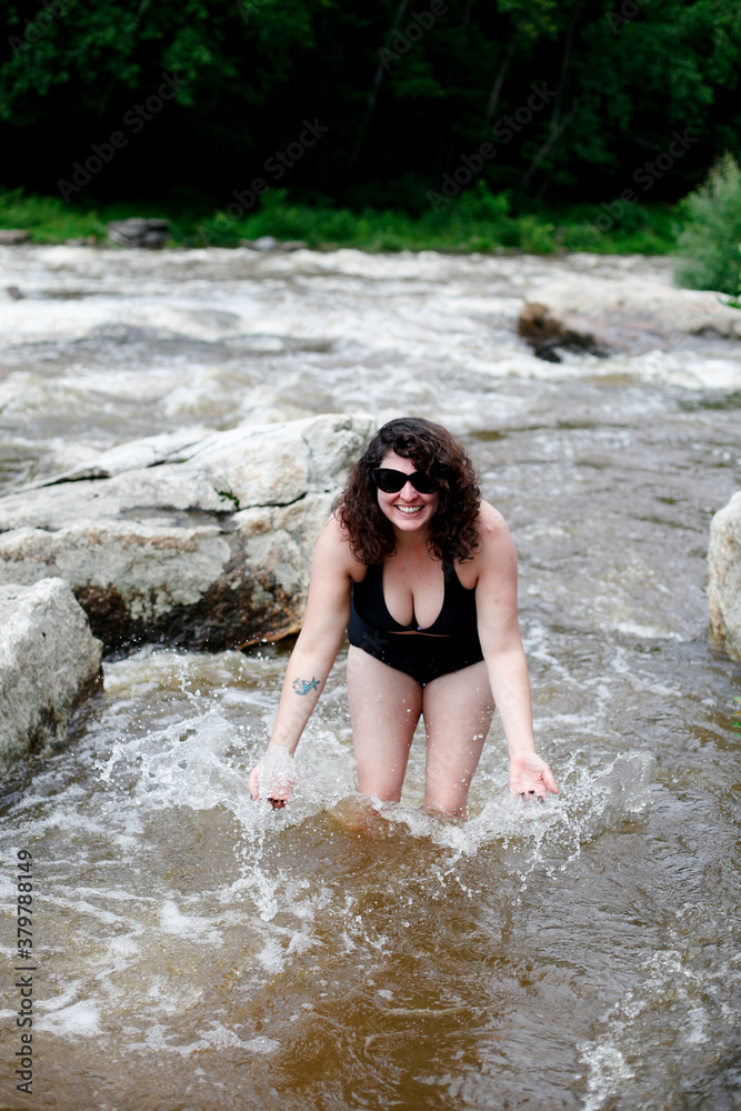 Woman in bikini in river Woman in bikini in river
