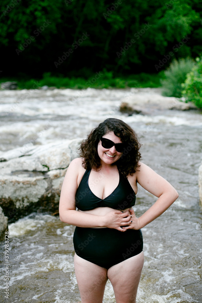 Woman in bikini in river Woman in bikini in river