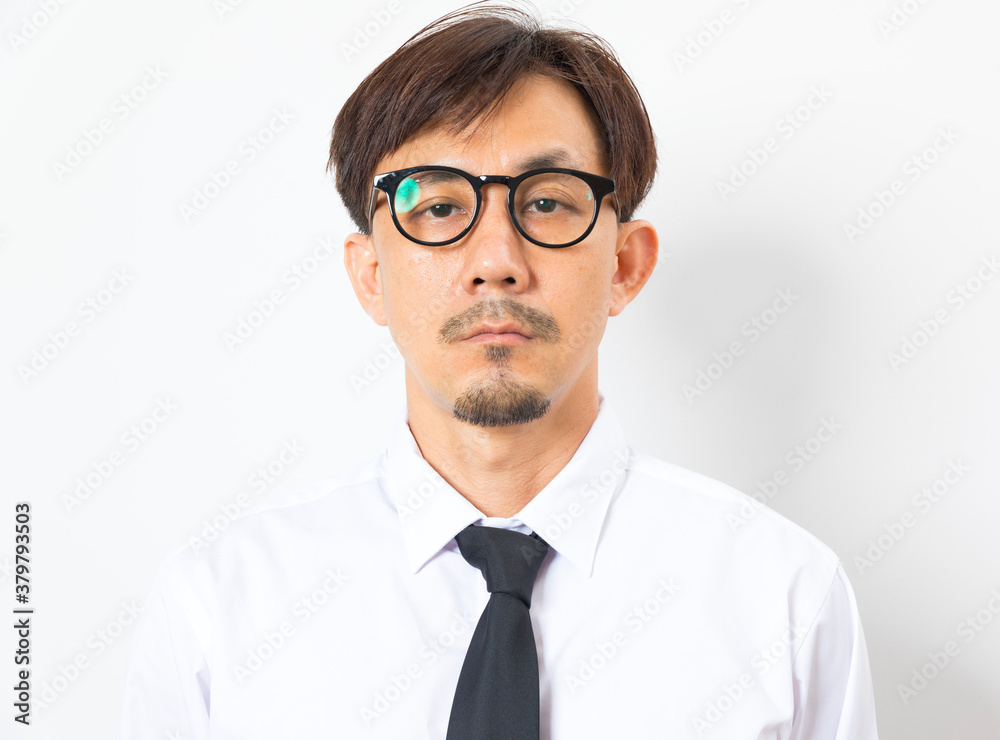 Chinese man wearing white shirt and tie standing over white background with hand on chin thinking about question. Chinese man wearing white shirt and tie standing over white background with hand on chin thinking about question.